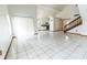 Bright living room featuring tile floors, high ceilings, and natural light from the sliding glass doors at 7440 Windsome Ct, Orlando, FL 32810