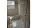Bathroom featuring a tiled shower/tub and a toilet at 7741 Bardmoor Hill Cir, Orlando, FL 32835