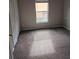Bedroom with carpet and a window at 7741 Bardmoor Hill Cir, Orlando, FL 32835