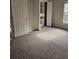 Cozy bedroom featuring neutral carpet, closet, and abundant natural light at 7741 Bardmoor Hill Cir, Orlando, FL 32835