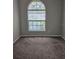 Cozy bedroom featuring a large window letting in plenty of natural light at 7741 Bardmoor Hill Cir, Orlando, FL 32835
