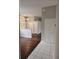 Inviting entryway with hardwood floors, a closet, and views into the living spaces at 7741 Bardmoor Hill Cir, Orlando, FL 32835