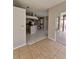 Spacious open layout from kitchen to patio with tile flooring and neutral paint at 7741 Bardmoor Hill Cir, Orlando, FL 32835