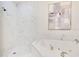 Bright bathroom features a soaking tub with marble surround and a separate shower with white tile at 8209 Tivoli Dr, Orlando, FL 32836