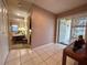 The Foyer features tiled floor and natural light coming through the decorative glass front door at 8216 Bluestar Cir, Orlando, FL 32819