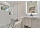 Modern bathroom featuring black and white patterned tile, a glass enclosed shower, and floating vanity at 900 W Plant St, Winter Garden, FL 34787