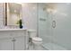 Modern bathroom featuring stylish tilework, glass enclosed shower and updated vanity at 900 W Plant St, Winter Garden, FL 34787