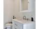 Bathroom with white vanity with a mirror cabinet on the wall at 900 W Plant St, Winter Garden, FL 34787