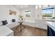 Cozy breakfast nook featuring a glass table, built-in seating, and natural light from the window at 900 W Plant St, Winter Garden, FL 34787