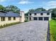 Beautiful two-story home with modern design, spacious driveway, and three-car garage at 900 W Plant St, Winter Garden, FL 34787