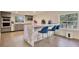Eat-in kitchen island features modern design, with stainless steel appliances at 900 W Plant St, Winter Garden, FL 34787