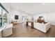 Bright living room with hardwood floors, a sectional couch, and natural light at 900 W Plant St, Winter Garden, FL 34787