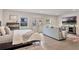 Spacious main bedroom with backyard access, sitting area, and modern furniture at 900 W Plant St, Winter Garden, FL 34787