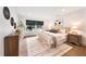 Comfortable main bedroom boasts a large window, modern decor, and neutral tones at 900 W Plant St, Winter Garden, FL 34787