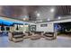 Relaxing patio with comfortable seating, overhead fan, and views of the backyard and pool at 900 W Plant St, Winter Garden, FL 34787