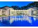 View of modern pool with lights and home architecture at 900 W Plant St, Winter Garden, FL 34787