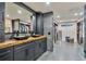 The walk-in closet features custom cabinets and drawers, a full length mirror, and vessel sinks on a wooden countertop at 900 W Plant St, Winter Garden, FL 34787