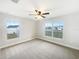 Cozy bedroom with carpeted floor, fan, and natural lighting at 947 Cumberland Dr, Kissimmee, FL 34759
