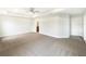 Large main bedroom with neutral walls and ensuite bathroom at 947 Cumberland Dr, Kissimmee, FL 34759