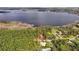 Gorgeous lakefront property featuring mature trees and private access to pristine lake, marked by a red border at 10433 Trout Rd, Orlando, FL 32836