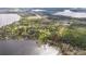 Aerial view of waterfront property marked with an arrow, providing lake access at 10433 Trout Rd, Orlando, FL 32836