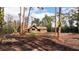 Charming home with a brick chimney nestled among mature trees on a spacious lot at 10433 Trout Rd, Orlando, FL 32836