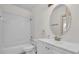 Bathroom features a combination tub and shower, white vanity, and neutral paint for a serene atmosphere at 10616 Emerald Chase Dr, Orlando, FL 32836
