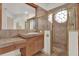 Bathroom featuring decorative tile, glass enclosed shower, and makeup vanity at 10616 Emerald Chase Dr, Orlando, FL 32836