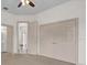 Bedroom with carpet flooring, ceiling fan, double door closet, and two doors to other rooms at 10616 Emerald Chase Dr, Orlando, FL 32836