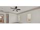 Bedroom featuring neutral walls, a ceiling fan, and natural light from the windows at 10616 Emerald Chase Dr, Orlando, FL 32836