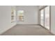 Bedroom with neutral walls, carpet, and a sliding door leading to the outside at 10616 Emerald Chase Dr, Orlando, FL 32836