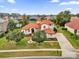 Charming home featuring a well-manicured lawn, mature trees, and a private driveway at 10616 Emerald Chase Dr, Orlando, FL 32836