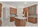 Bright kitchen with a central island, ample cabinet space, and tiled flooring at 10616 Emerald Chase Dr, Orlando, FL 32836