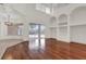 Hardwood floored living room featuring a pool view, fireplace, and custom built ins at 10616 Emerald Chase Dr, Orlando, FL 32836