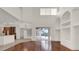 Open living space with fireplace, hardwood floors, high ceilings, and pool view at 10616 Emerald Chase Dr, Orlando, FL 32836