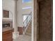 Spacious living area with a fireplace, high ceilings, and staircase with iron railing at 10616 Emerald Chase Dr, Orlando, FL 32836