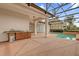 The patio features a convenient outdoor kitchen area near the screened-in pool and spa at 10616 Emerald Chase Dr, Orlando, FL 32836