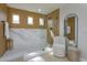 Beautiful bathroom with glass shower enclosure, wood plank walls and modern fixtures at 1077 Fountain Coin Loop, Orlando, FL 32828