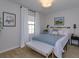 Bright bedroom features a comfortable bed, stylish bench, and charming decor at 1077 Fountain Coin Loop, Orlando, FL 32828