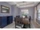 Stylish dining room featuring a spacious table, buffet with wine storage, and contemporary lighting at 1077 Fountain Coin Loop, Orlando, FL 32828