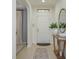 Bright and welcoming home foyer with a decorative table, stylish mirror, and neutral color palette at 1077 Fountain Coin Loop, Orlando, FL 32828