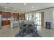 Bright kitchen and dining area with a view to sliding glass doors to the outdoor space at 1077 Fountain Coin Loop, Orlando, FL 32828