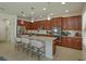 Modern kitchen with stainless steel appliances, a granite island, and a breakfast bar with seating at 1077 Fountain Coin Loop, Orlando, FL 32828