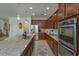 Modern kitchen with stainless steel appliances, granite countertops, and lots of cabinet space at 1077 Fountain Coin Loop, Orlando, FL 32828