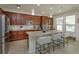 Stylish kitchen featuring an island with seating, stainless steel appliances, and plenty of counter space at 1077 Fountain Coin Loop, Orlando, FL 32828