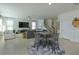 Open floor plan with tile floors and view of the staircase at 1077 Fountain Coin Loop, Orlando, FL 32828