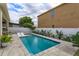 Inviting pool with tanning deck, framed by lush landscaping for backyard privacy at 1077 Fountain Coin Loop, Orlando, FL 32828