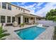 Stunning pool with sun shelf, grill area, covered patio, and backyard privacy at 1077 Fountain Coin Loop, Orlando, FL 32828