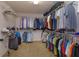 Organized walk-in closet featuring ample shelving and hanging space for clothes and accessories at 1077 Fountain Coin Loop, Orlando, FL 32828