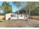 Wide backyard with new fence, mature trees and an outdoor shed at 1300 Montego Ln, Orlando, FL 32807